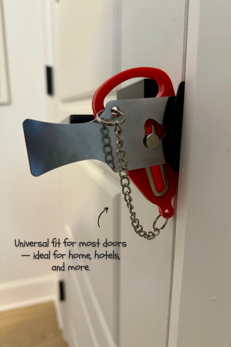 Portable door lock installed on a white door
