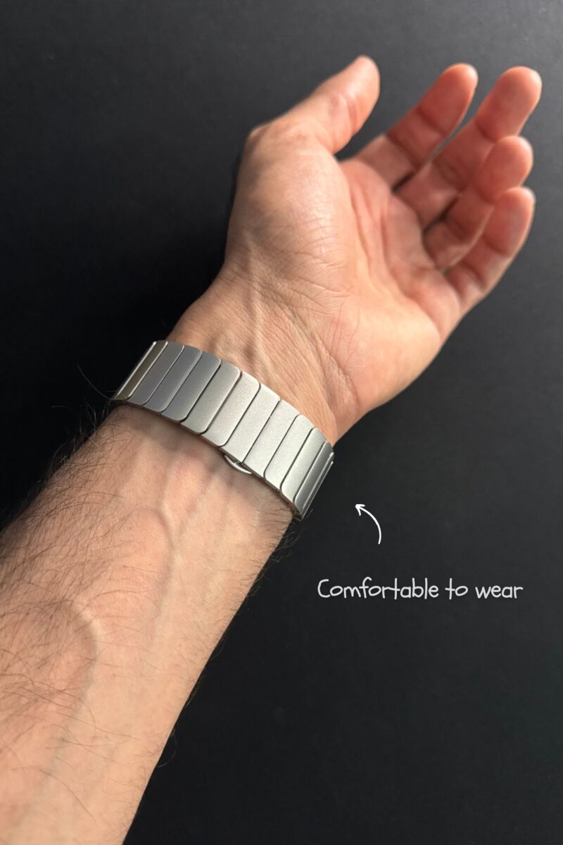Metal Apple Watch band sitting comfortably on a hairy wrist