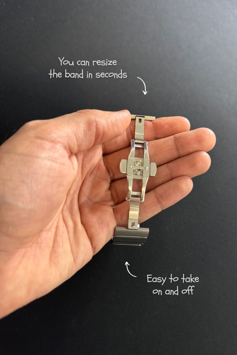 The band’s folding clasp held open in a hand